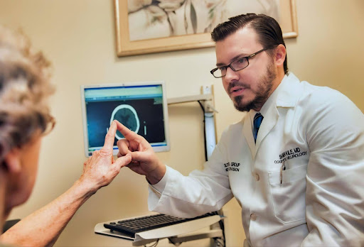Doctor touching patient's finger during consultation